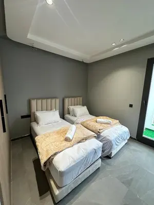 two twin beds in a room with at familyconfort casa evasion in Casablanca