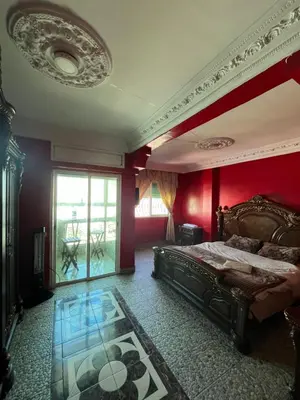 a bedroom with red walls and a bed with a glass floor at Casablanca Family in Casablanca