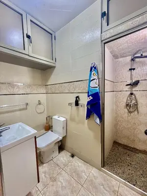 a bathroom with a toilet and a sink and a shower at Casablanca Family in Casablanca