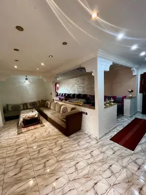 a large living room with a couch and a table at Casablanca Family in Casablanca