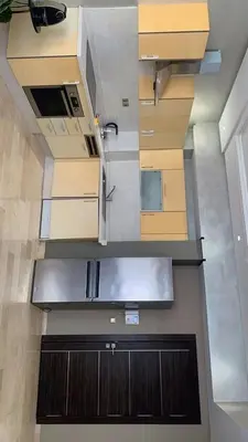a kitchen with wooden cabinets and a sink at Cosy C35 in Casablanca