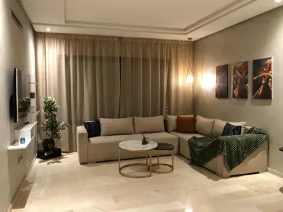 a living room with a couch and a table at Cosy C35 in Casablanca