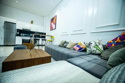 a living room with two couches and a kitchen at casablanca maroc in Casablanca
