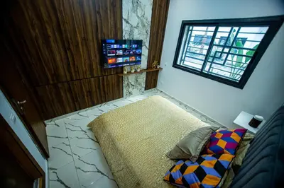 a small bedroom with a bed and a window at casablanca maroc in Casablanca