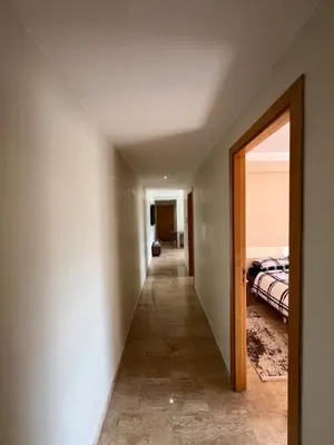 a hallway leading to a bedroom in a house at L'Appart du Carousel in Rabat