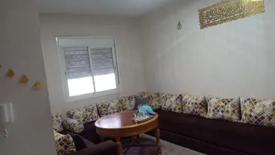 a living room with a couch and a table at confy house in Casablanca