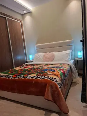 a bedroom with a bed with a blanket on it at Luxury studio 20 in Casablanca