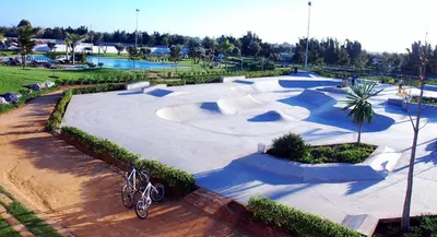 a skate park with a skateboard ramp and a bike parked at Eden Island Villa - Bouznika in Bouznika