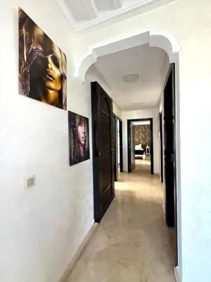 a hallway of a house with paintings on the walls at Oumadane Appart-Ocean view- Amazing apartment-International Fair and more near by in Casablanca