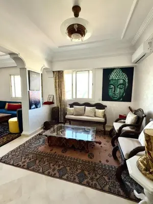 a living room with a couch and a coffee table at Oumadane Appart-Ocean view- Amazing apartment-International Fair and more near by in Casablanca