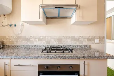 a kitchen with a stove and a counter top at Modern 1 Bedroom W Terrace- Rabat City Center in Rabat