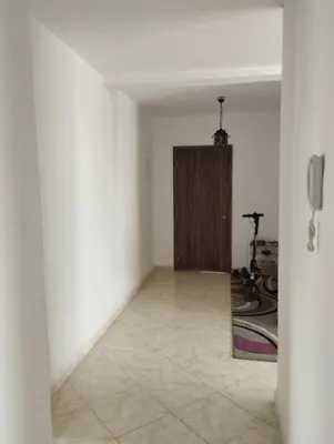 a hallway with a door in a room at résidence les perles de Bouznika in Bouznika