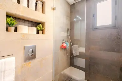 a bathroom with a shower with a glass door at Studio Cosy, corniche à 2 min , Parking , Netflix in Casablanca