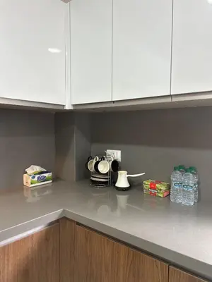 a kitchen with white cabinets and a counter top at شقة فخمه Luxury apartment in Casablanca