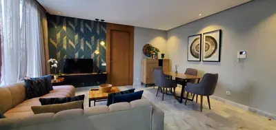 a living room with a couch and a table at Luxurious apartment casablanca in Casablanca