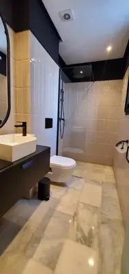 a bathroom with a sink and a toilet at Luxurious apartment casablanca in Casablanca