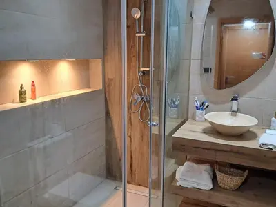 a bathroom with a glass shower and a sink at Chahd appart centre de Rabat pour famille in Rabat