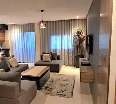 a living room with a couch and a table at Chahd appart centre de Rabat pour famille in Rabat