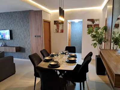 a dining room with a table and chairs at Chahd appart centre de Rabat pour famille in Rabat