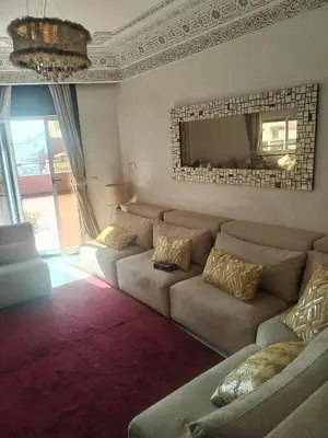a living room with a couch and a mirror at Sense house 2 in Rabat