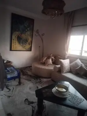 a living room with a couch and a table at Sense house 2 in Rabat