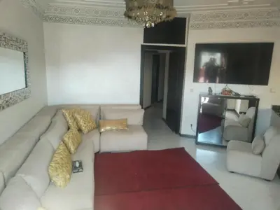a living room with a couch and two chairs at Sense house 2 in Rabat
