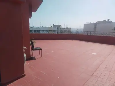 a bench sitting on top of a roof at Sense house 2 in Rabat