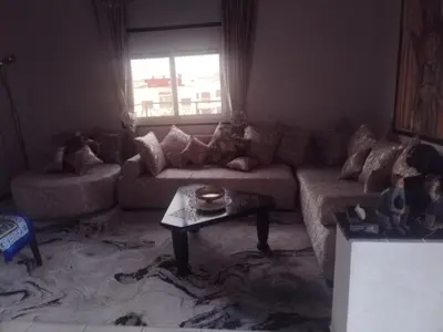 a living room with a couch and a table at Sense house 2 in Rabat