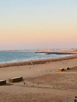 a group of people on a beach with the ocean at Appartement Miramar vue panoramique Mohammedia in Mohammedia