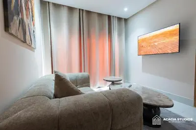 a living room with a couch and a table at Acacia Studio 10 in Casablanca