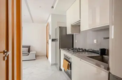 a kitchen with a sink and a stove top oven at Sunshine sea view studio in Casablanca