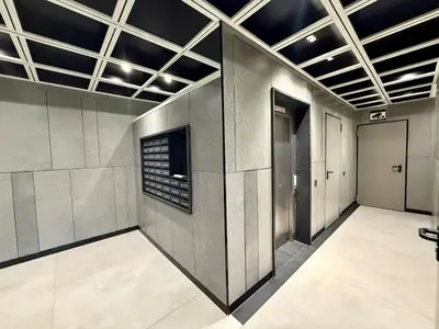 a hallway of a building with a elevator at Parking - Stunning View - Modern cozy and central in Casablanca
