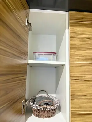 a basket sitting inside of a kitchen cabinet at Parking - Stunning View - Modern cozy and central in Casablanca