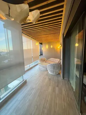 a living room with a couch and a table at Ultimate ocean luxury in Tamaris