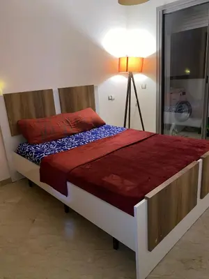 a bedroom with a bed with a lamp on it at Maison de la paix in Casablanca