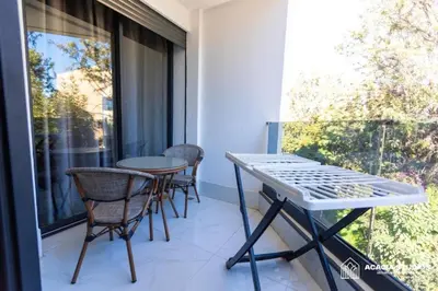 a balcony with a table and chairs and a window at Acacia Studio 04 in Casablanca