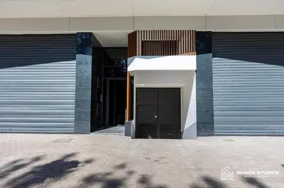 a building with a black door on the side of it at Acacia Studio 04 in Casablanca
