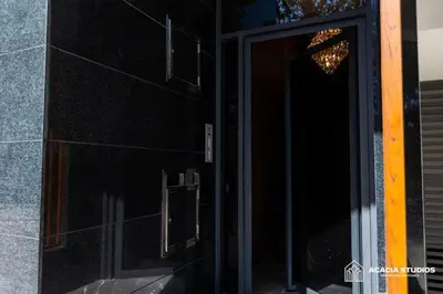 a door to a building with a chandelier on it at Acacia Studio 06 in Casablanca