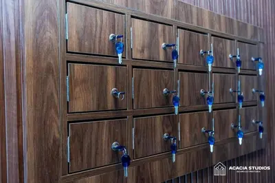 a row of wooden lockers with blue handles at Acacia Studio 07 in Casablanca
