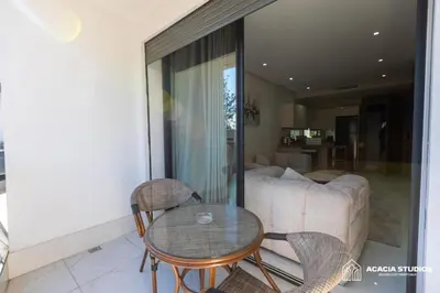 a living room with a table and chairs and a couch at Acacia Studio 08 in Casablanca