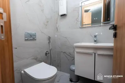 a bathroom with a toilet and a sink at Acacia Studio 08 in Casablanca