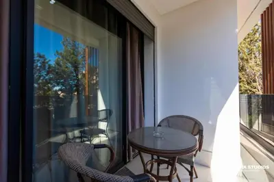 a balcony with a table and chairs and a window at Acacia Studio 08 in Casablanca