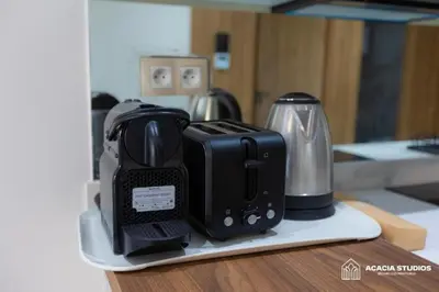 a black toaster sitting on top of a counter at Acacia Studio 09 in Casablanca
