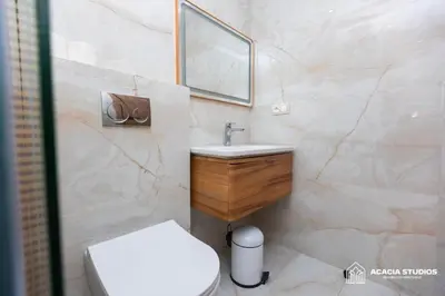 a bathroom with a white toilet and a sink at Acacia Studio 09 in Casablanca