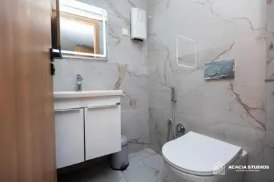 a bathroom with a white toilet and a sink at Acacia Studio 12 in Casablanca