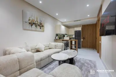 a living room with a couch and a table at Acacia Studio 13 in Casablanca