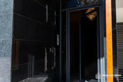 a door to a building with a chandelier on it at Acacia Studio 14 in Casablanca