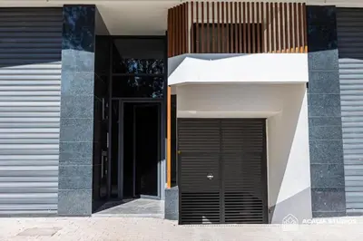 a building with a black door on the side of it at Acacia Studio 15 in Casablanca