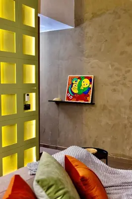 a bedroom with a bed and a painting on the wall at Beyti in Rabat
