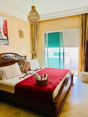 a bedroom with a bed with a basket on it at Top Location Apartment City Center 1min Away From Tram Station in Casablanca